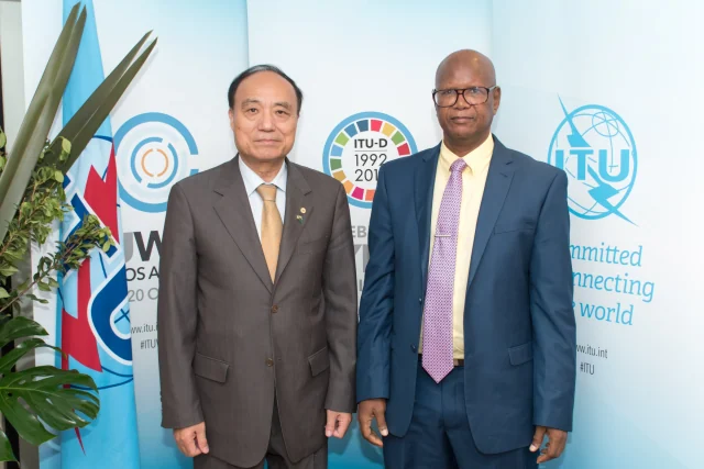 Demba A. Jawo (right) with ITU Secretary-General Houlin Zhao. Photograph: ITU / D. Woldu.