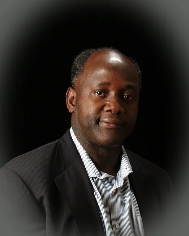 Photograph of Tijan M. Sallah
